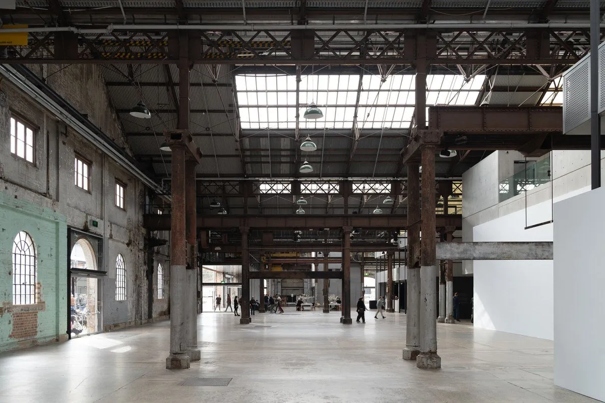 Interior of an Australian industrial warehouse with exposed steel beams, the receiving point for imported lighting and accessory orders