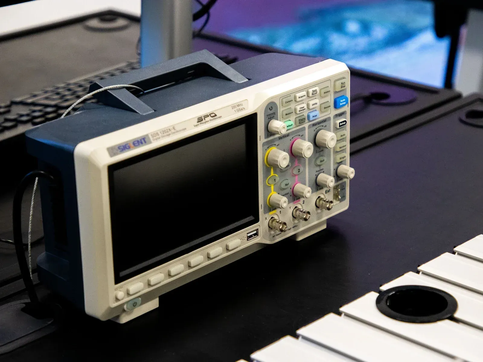 Electrical test instruments on a laboratory bench, the type-testing evidence behind an ETL, CE or SAA certificate for a recessed downlight