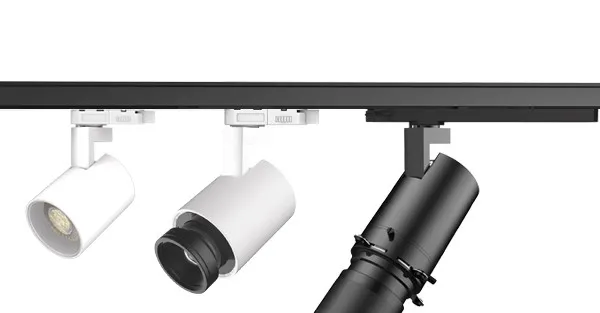 Encore track light lamp holders and adapters in white and black finishes mounted on a track rail showing the interchangeable head family
