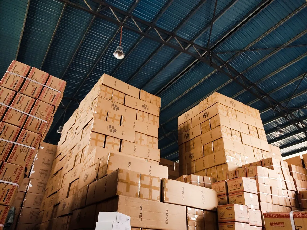 High stacks of export cartons in a warehouse ready for shipping SAA and RCM compliant lighting accessories to Australia