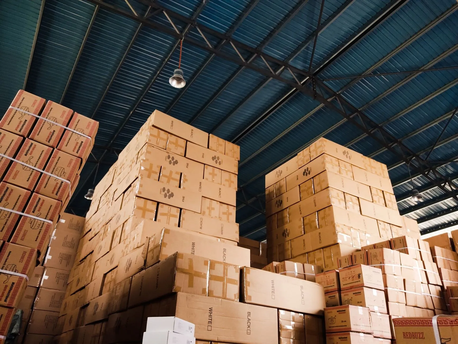 High stacks of export cartons in a warehouse, ready for shipping SAA certified LED lighting to Australia
