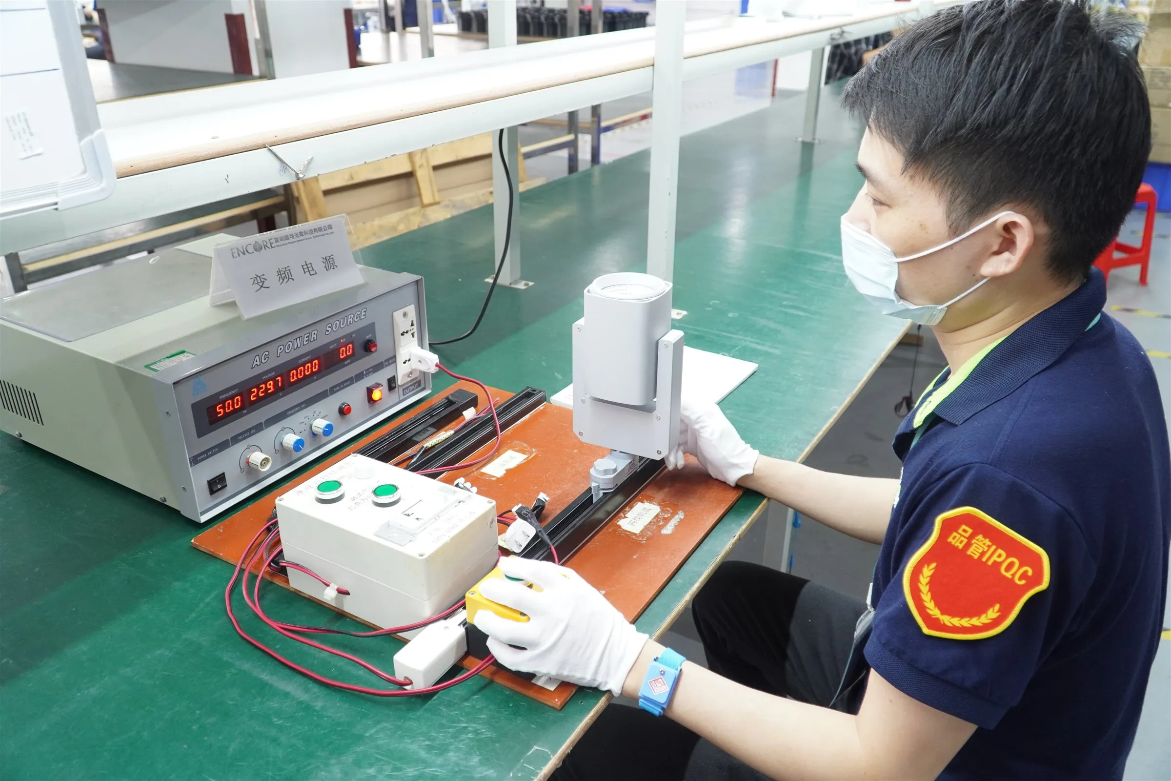 ENCORE factory operator running an electrical safety test at the production line for SAA approved LED lighting