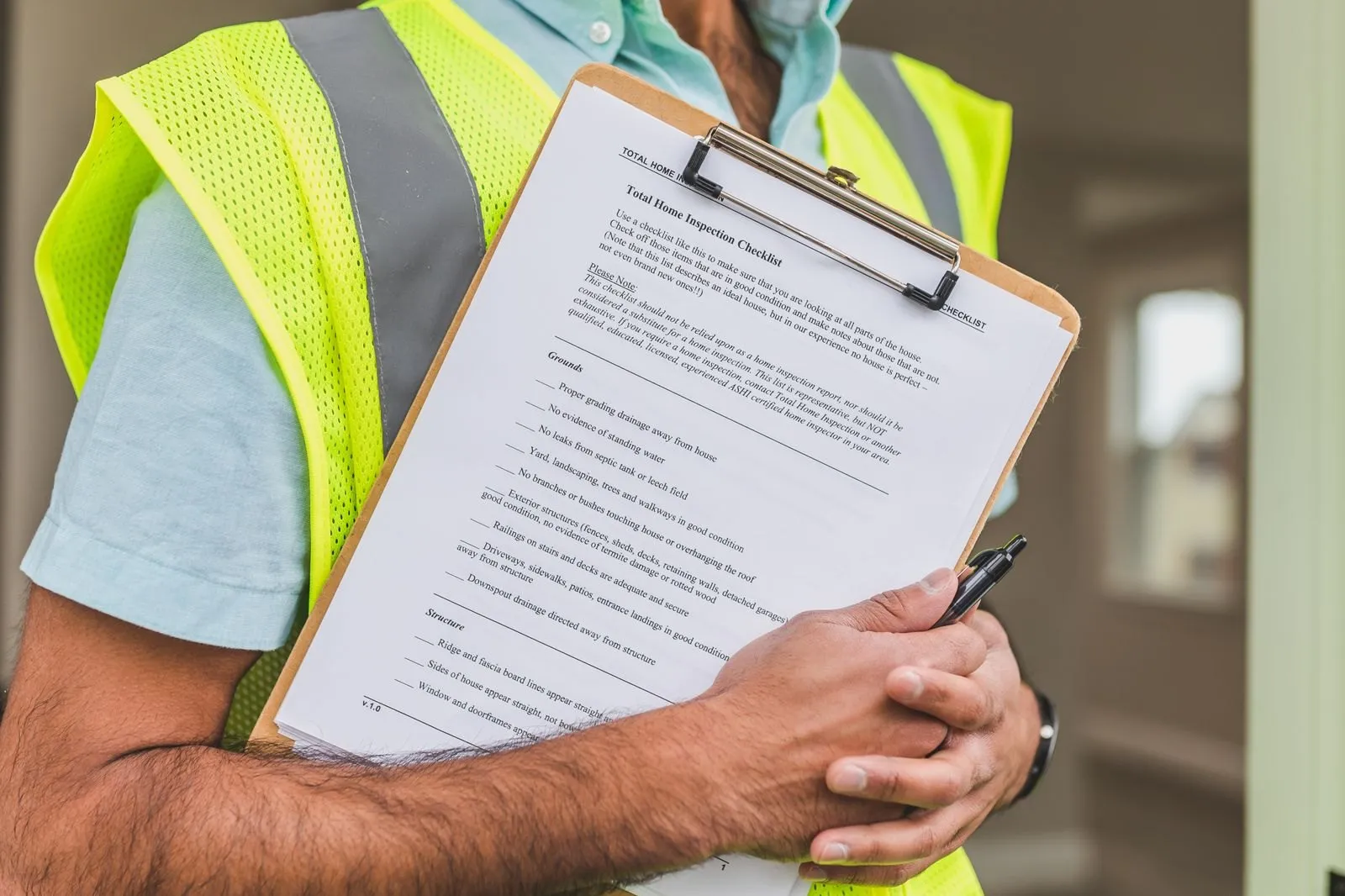 An importer working through a CE compliance checklist on a clipboard before releasing an LED lighting order for shipment to the EU