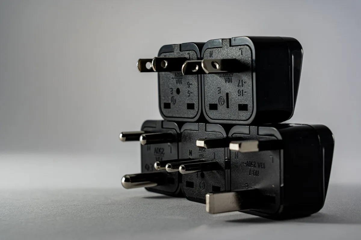 Black plug-in LED driver power adapter units photographed on a plain background