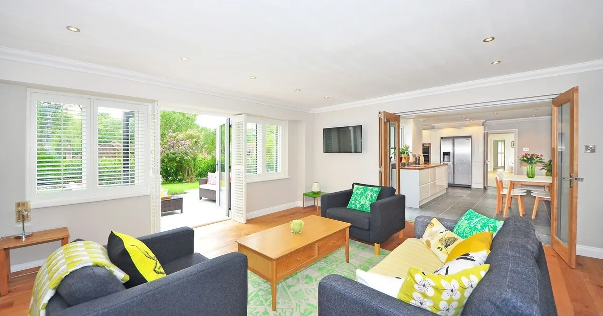Australian open plan living room with recessed ceiling downlights, an example of SAA approved lighting installed in a home