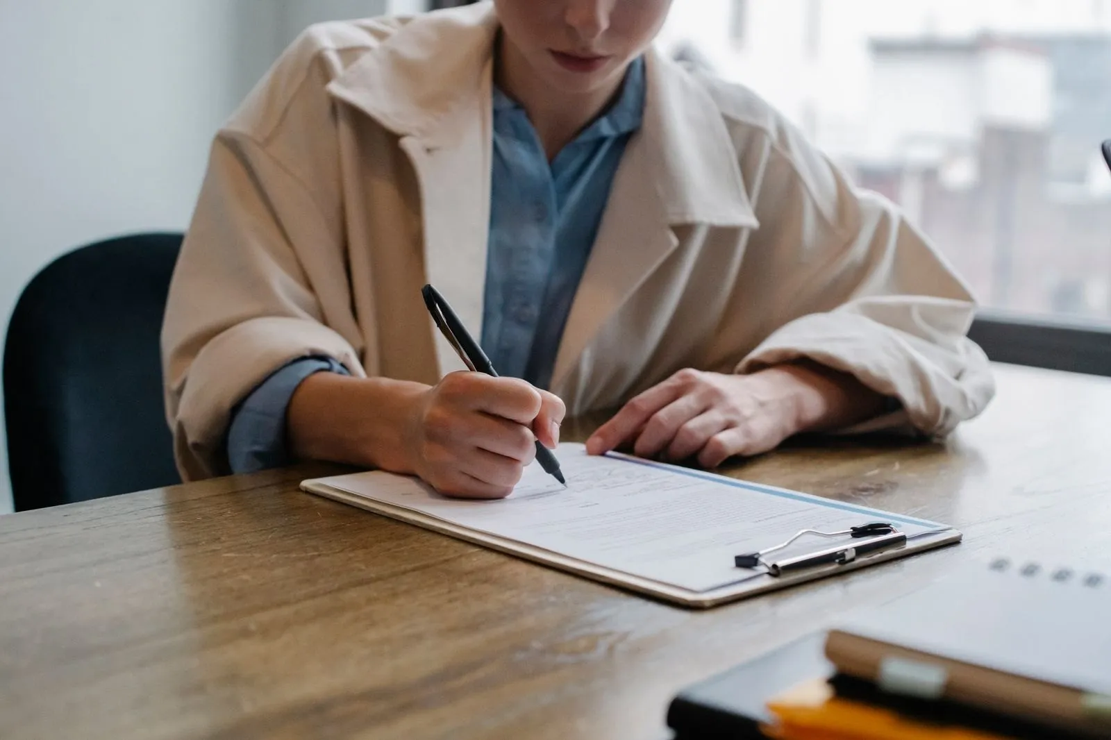 A manufacturer's representative signing the EU Declaration of Conformity for LED lighting — the only CE document that carries legal weight by itself