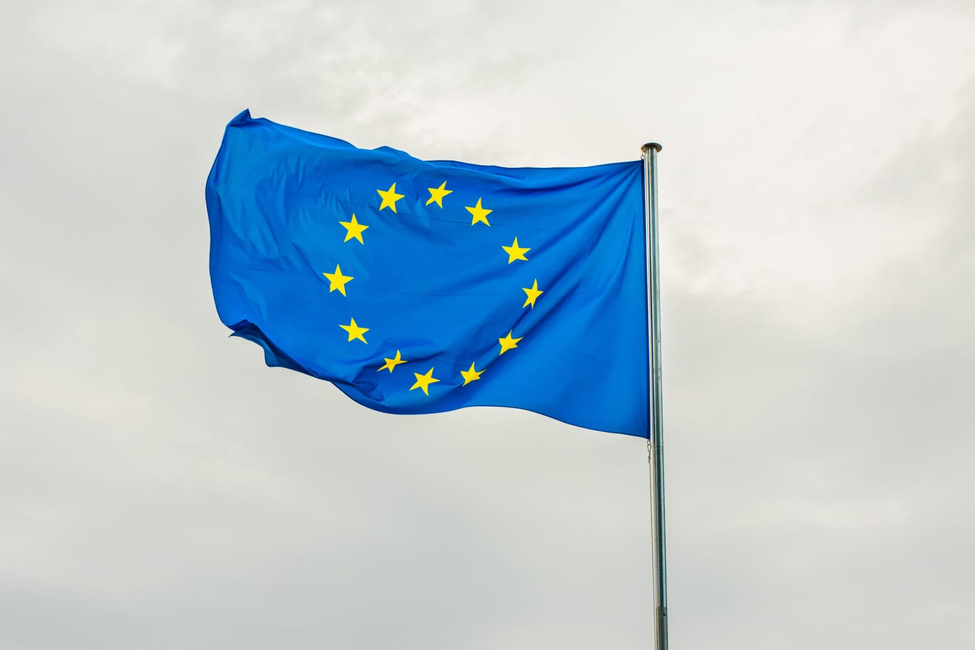 European Union flag alone against an overcast sky — the single market CE marking gives access to